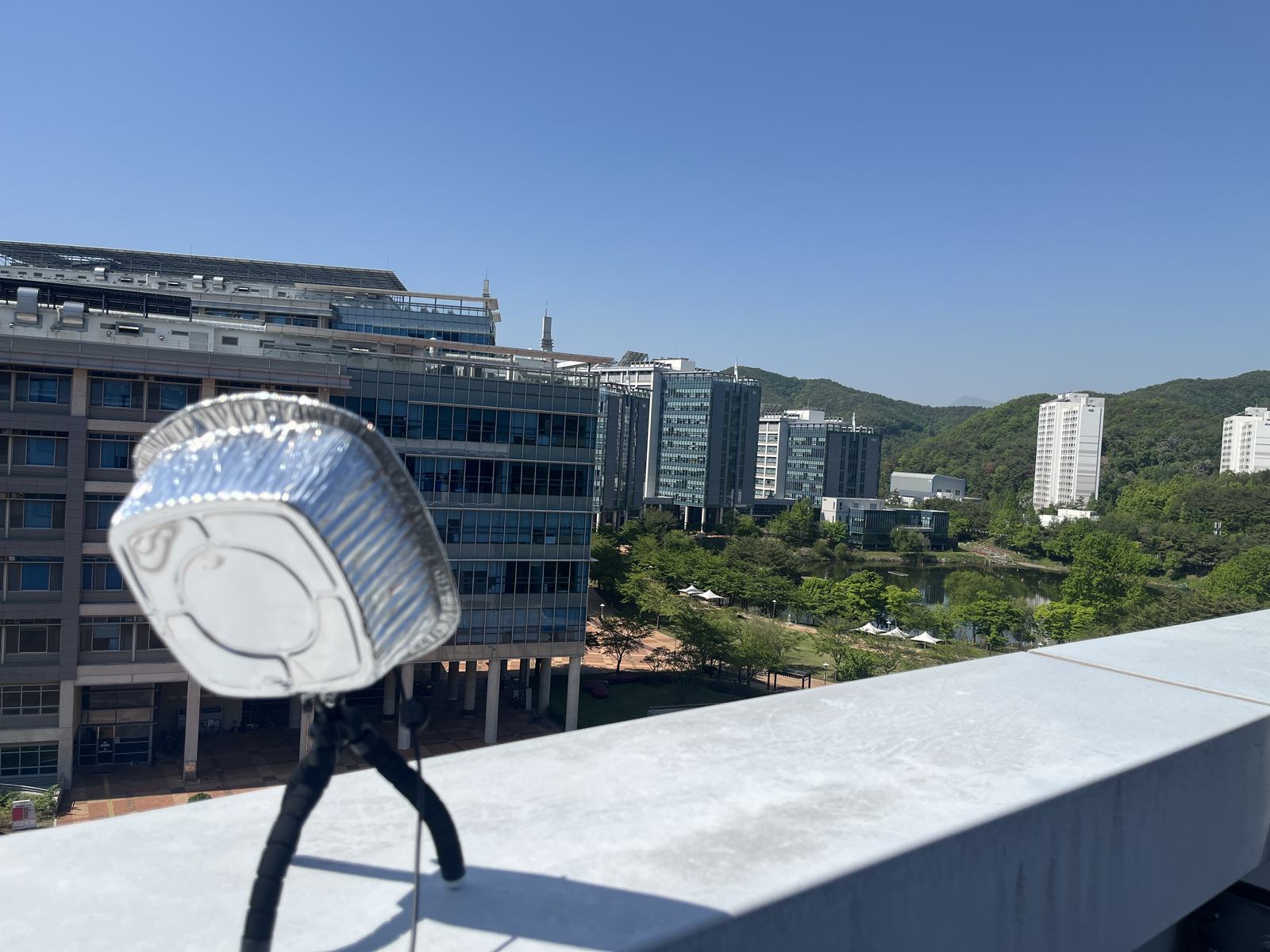 First satellite receiver: a dipole antenna on a tripod with an aluminum dish